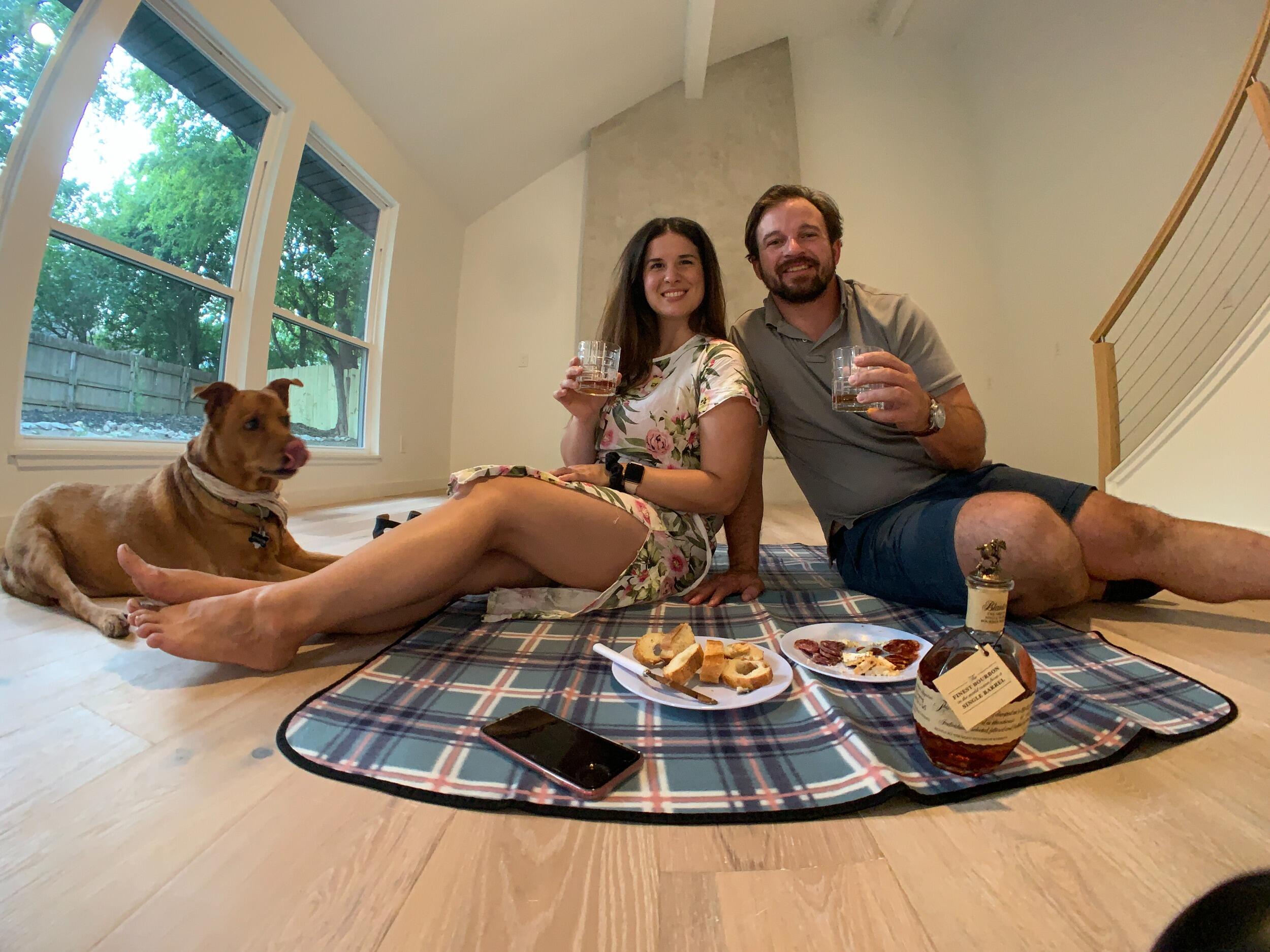 We closed on a house!  We celebrated the occasion with a bottle of Blantons on the floor with Atticus (we mis him).