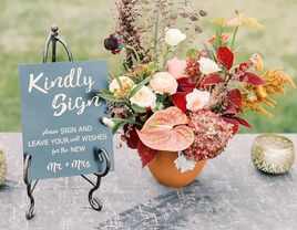 'Kindly Sign' and details in cursive type on slate-colored background