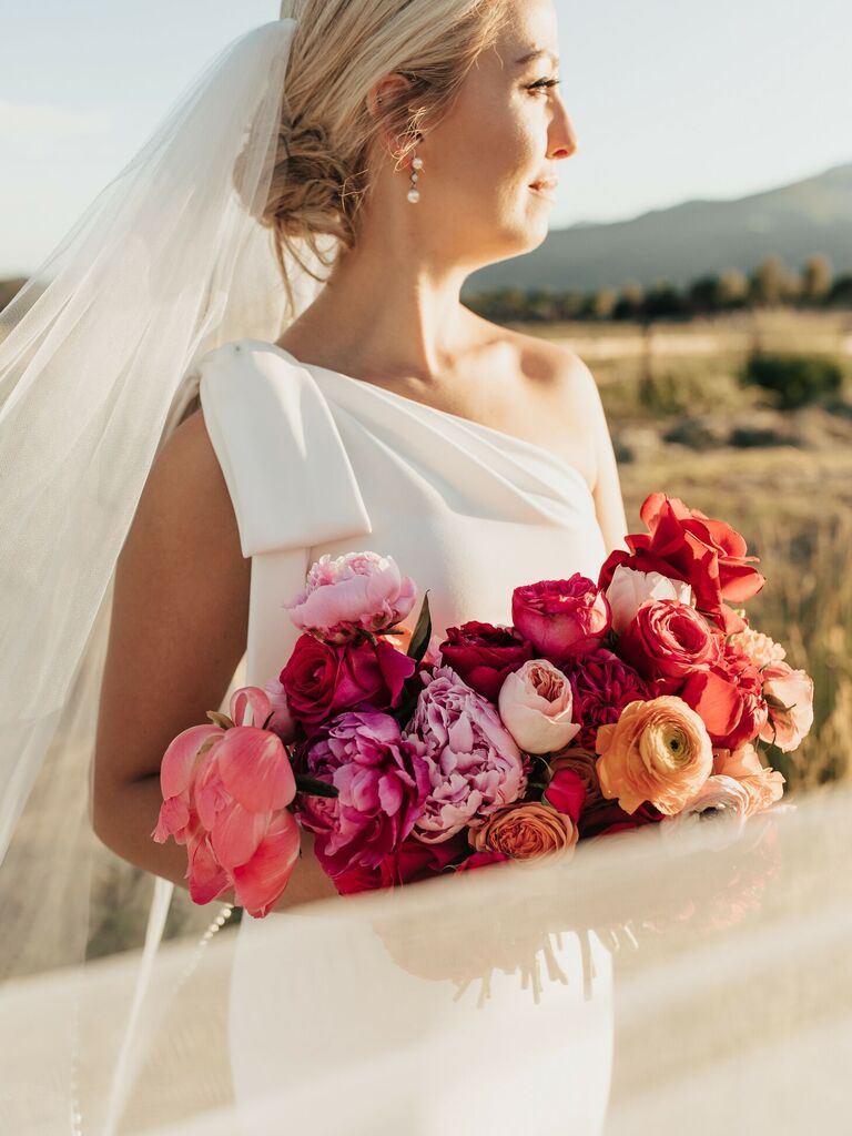 bride wearing one shoulder wedding dress