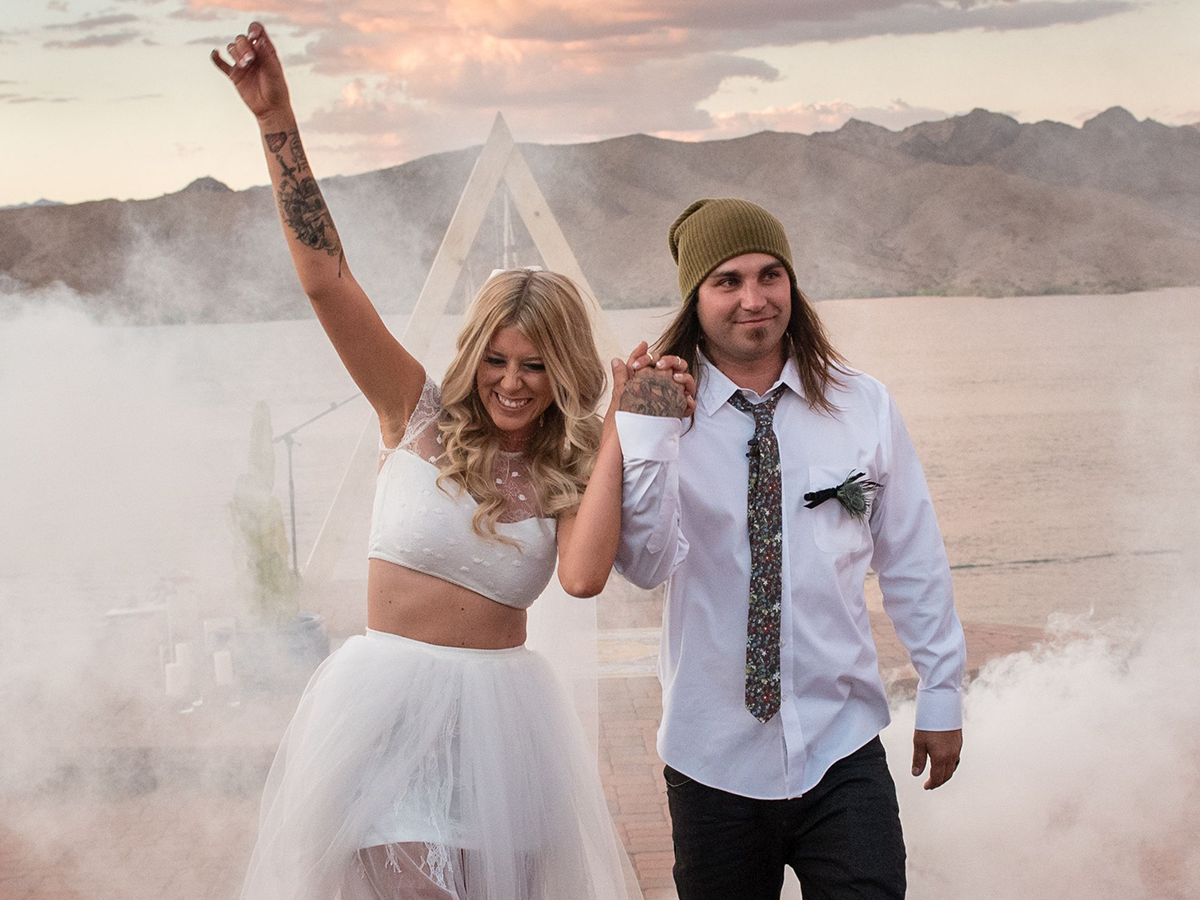 Tattooed bride with groom on wedding day
