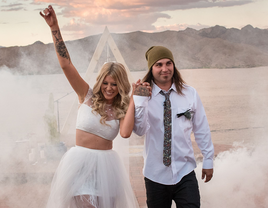 Tattooed bride with groom on wedding day