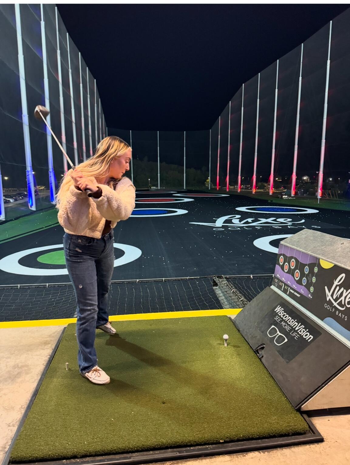Luke showing Dani some tips and trick to LUXE Golf