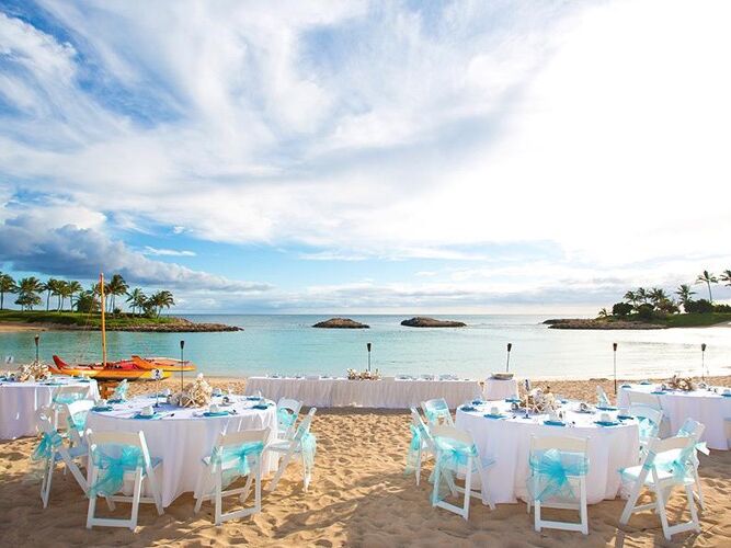 A wedding reception on Aulani Beach at Disney's Hawaii resort