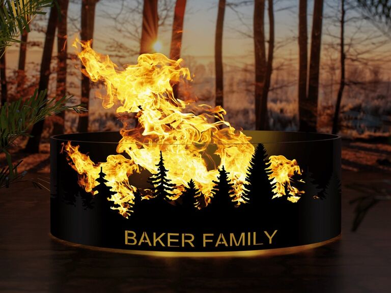 Custom steel fire pit featuring a family name and the silhouette of trees Etsy wedding gift idea