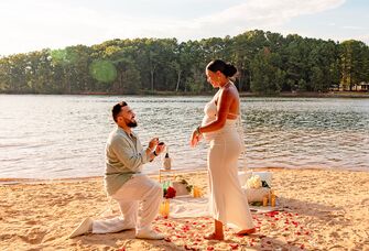 Man proposing to woman on beach in Charlotte, NC