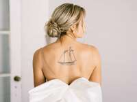 Picture of bride in backless dress with spray tan