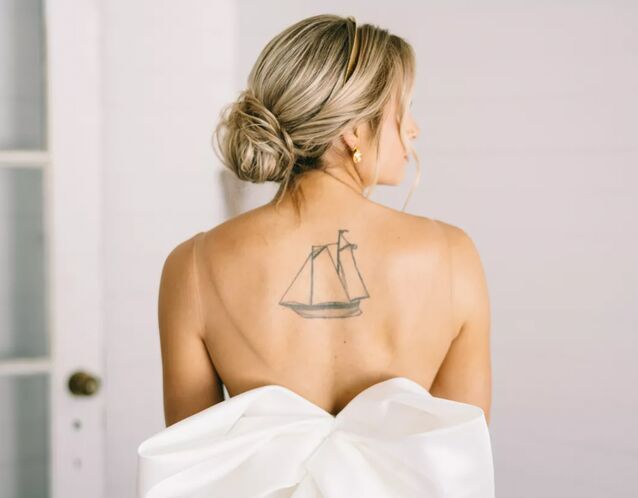 Picture of bride in backless dress with spray tan