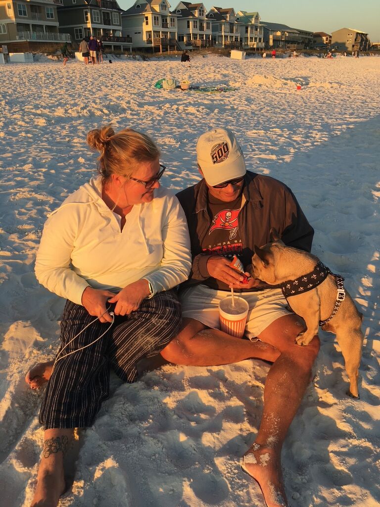 with a new friend on Miramar Beach, FL.