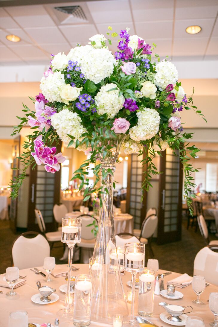 Purple Rose And White Hydrangea Centerpiece In Tall Glass