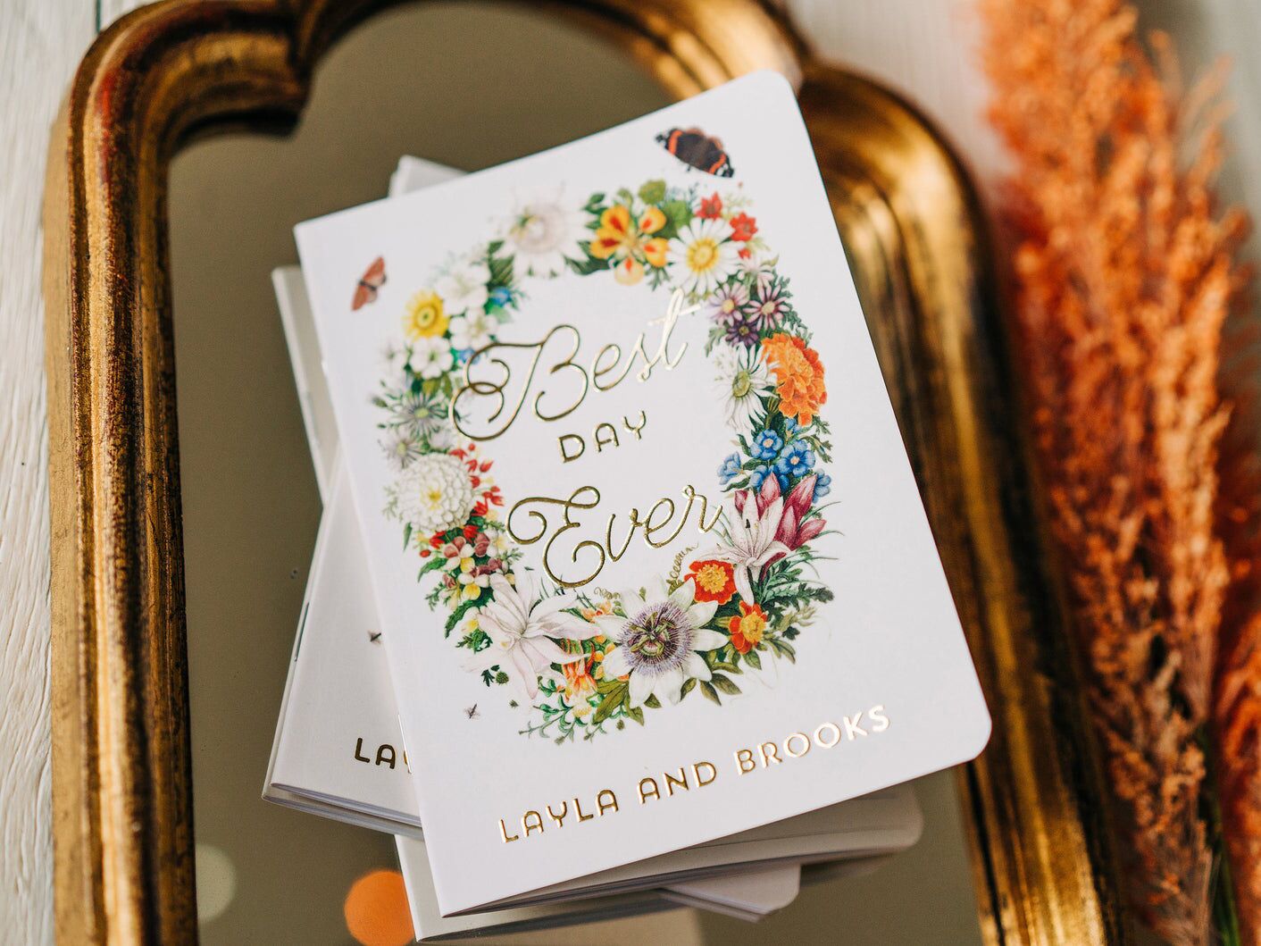 floral vow books with gold foil writing