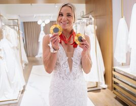 Oksana Masters with her Paralympic medals trying on wedding dresses