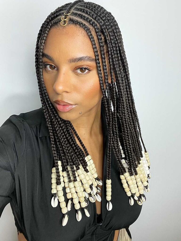 Braided Black hairstyle with beaded accessories