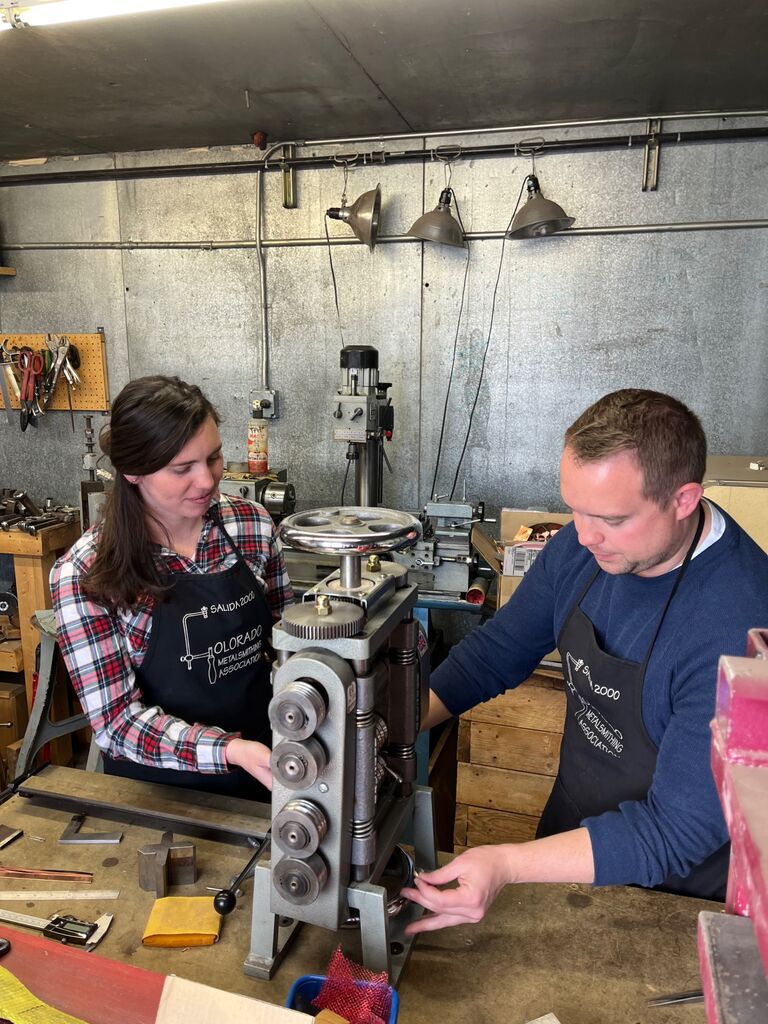 We made each other’s wedding bands from scratch in Salida, CO. We worked with a metalsmith to forge each other's band so as to literally make our promises to each other for each other.  Fun fact: part of Shannon’s engagement ring (which was too big at the time) is in Evan’s band!
