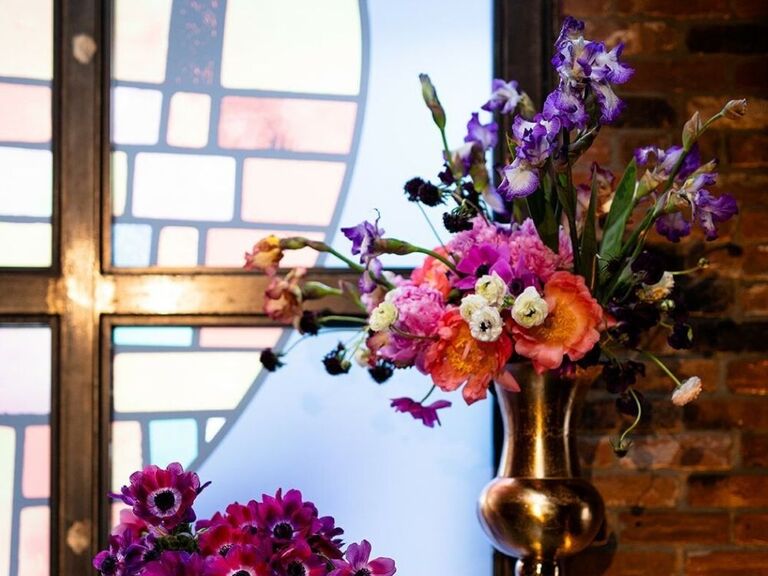 A church altar arrangement with purple iris flowers