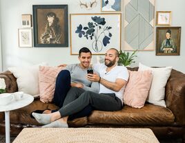 couple on couch planning wedding