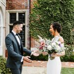 bride and groom smile during wedding first look