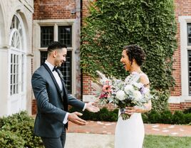 bride and groom smile during wedding first look