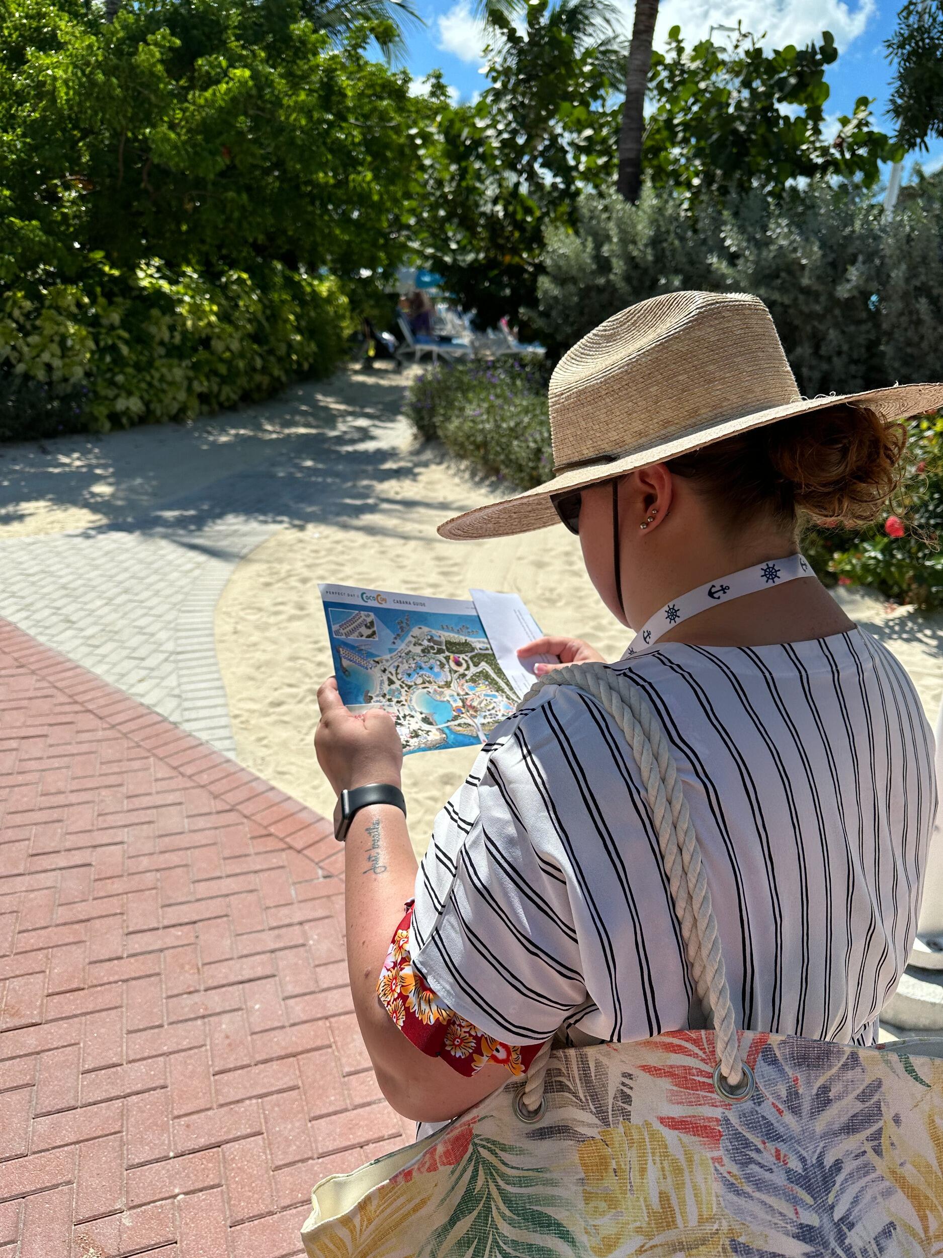Sarah took on the task of finding their day bed at Coco Cay. But she kept getting confused about where they were. Brett called her "My Little Navigator!" She looks like Joey in "Friends" trying to get into the map in London. 
