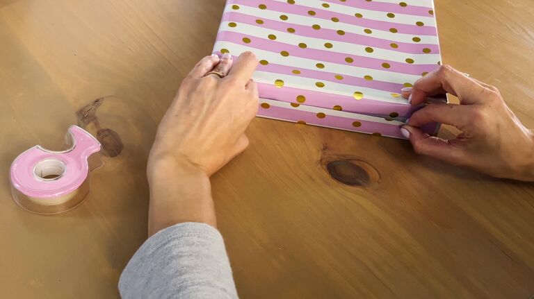 Step eleven for wrapping a gift