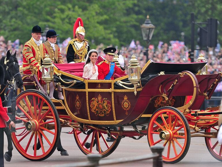 William and Kate on their wedding carriage. 
