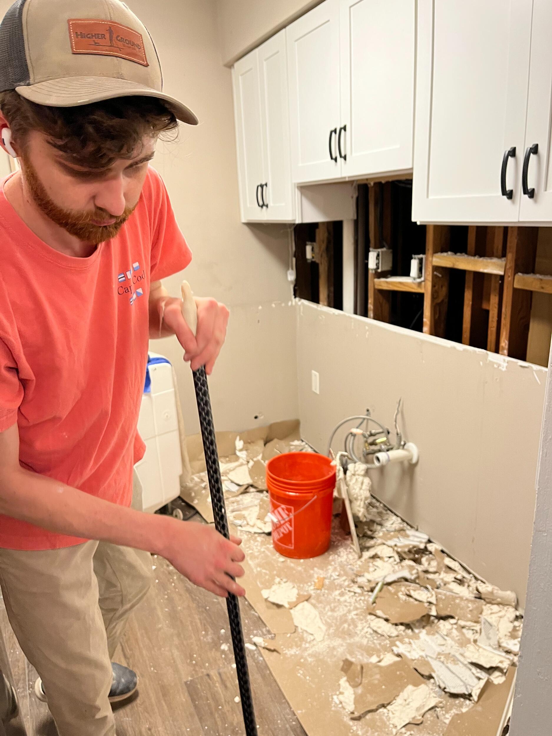 Alex fixes Taylor's flooded condo (the first of many projects Taylor ropes Alex into). 