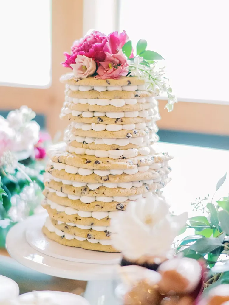 cookie cake topped with flowers at wedding shower or wedding