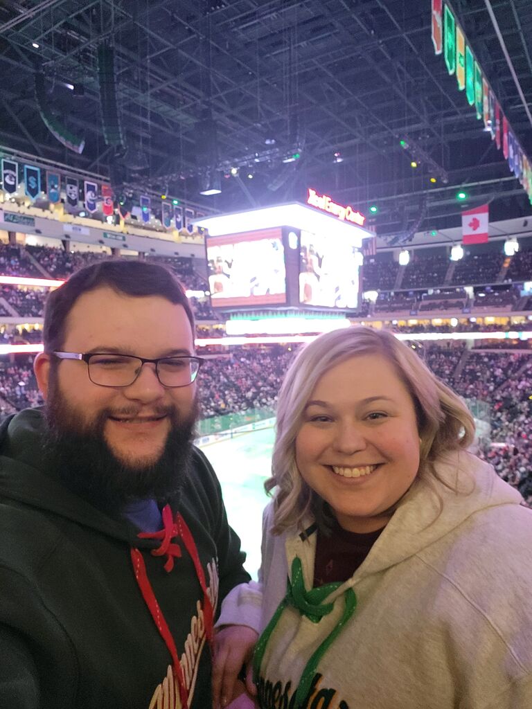 Go Wild! David is determined to make a hockey fan out of Jess... it is working.
