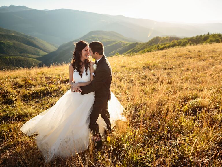 Colorado wedding couple posing in front of mountains