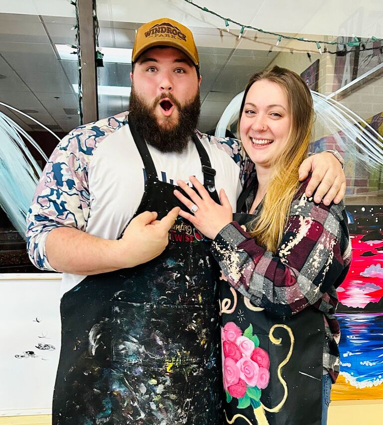 If you've made it this far in the photo timeline, you've reached the day that sparked the need for a wedding website! After proposing in our kitchen, we celebrated at a Sip and Paint with friends...