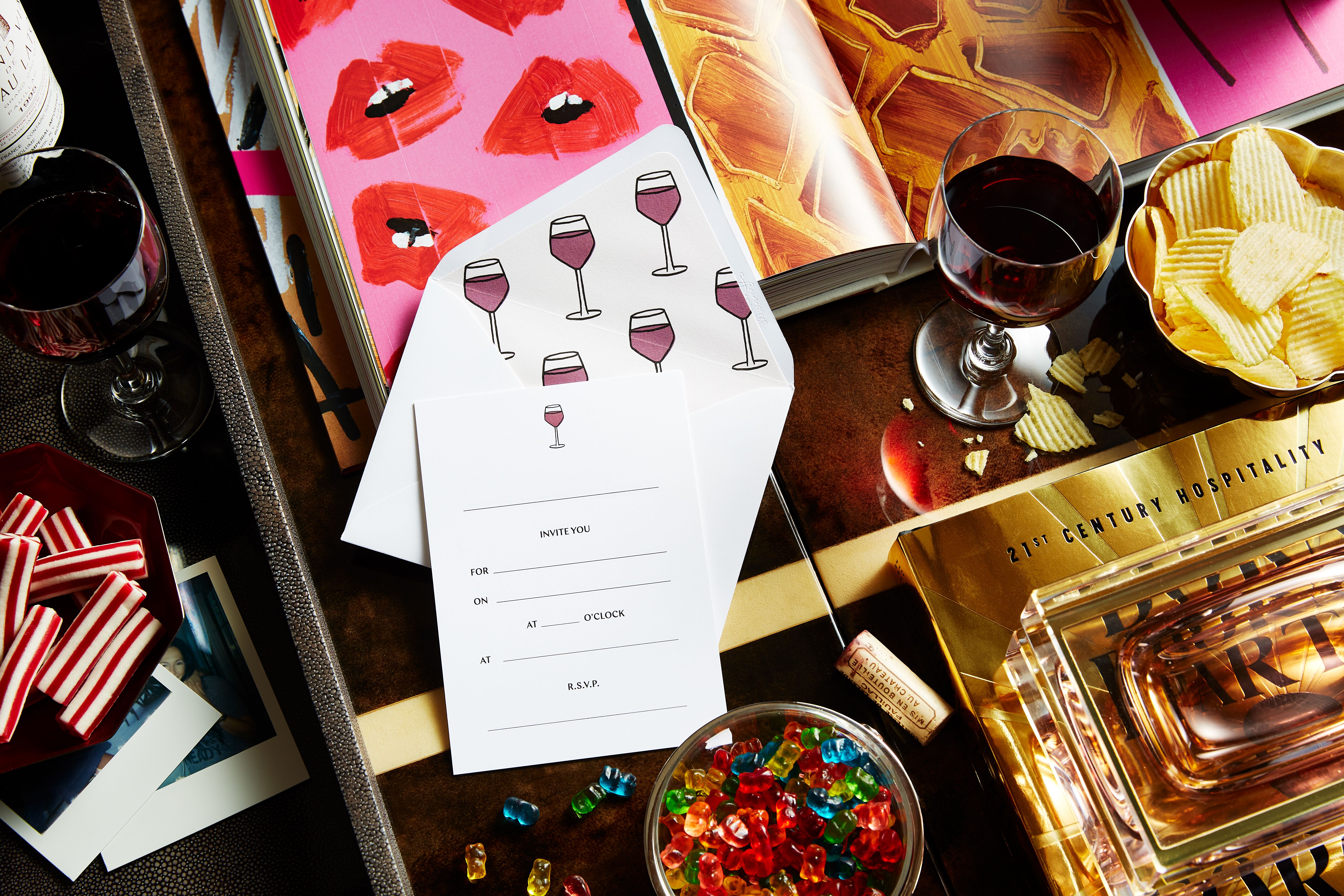 Bachelorette party flatlay invitations gummies chips wine
