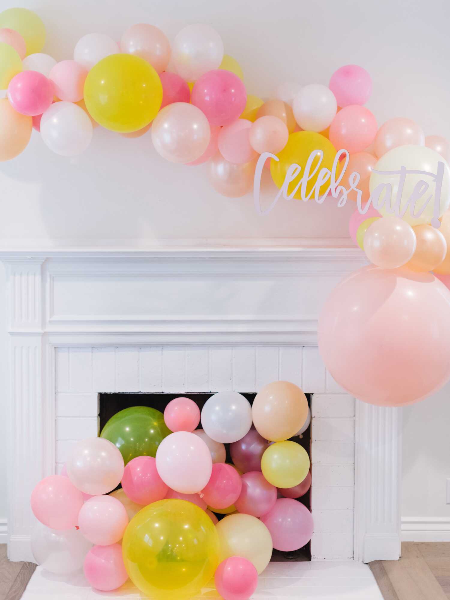 Yellow and pink balloon garland decor