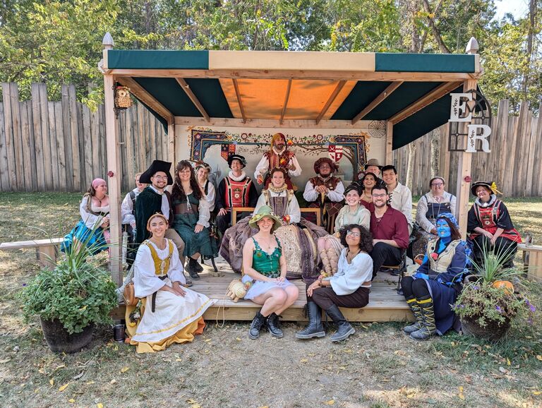 Kristen, Yang-Yang and friends sitting with the Queen's Court at the Ohio Rennaissance Festival.