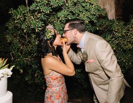 Bride and groom with snacks and wedding reception