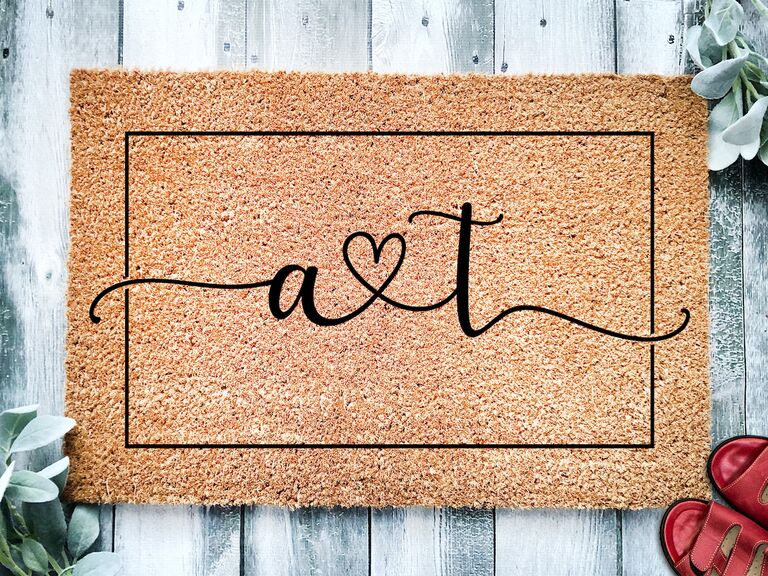 Custom doormat featuring cursive initials and a heart Etsy wedding gift idea
