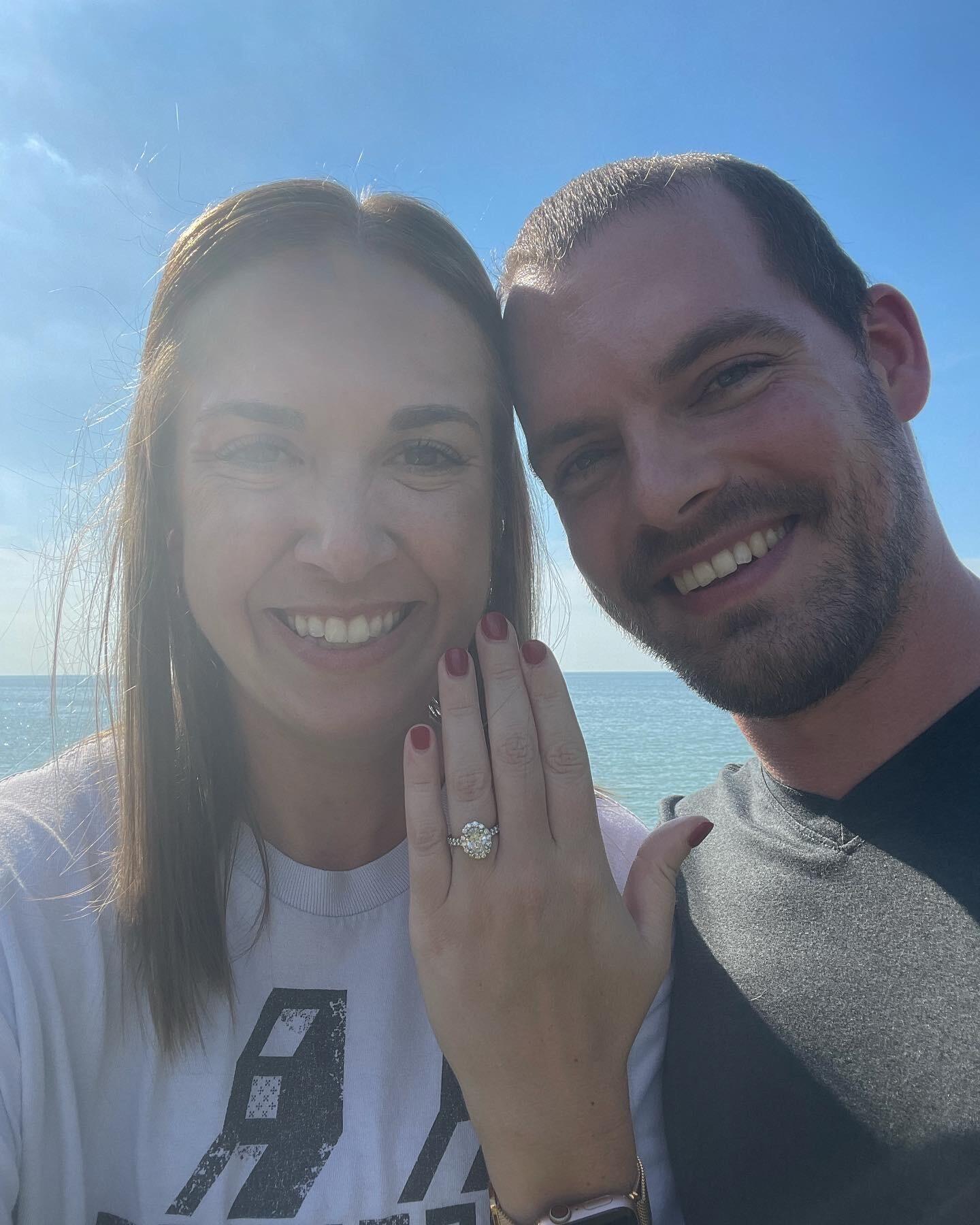 Ryan proposed! He asked Shelby to go up to their favorite spot on Lake Erie after work and surprised her with the most beautiful ring that he had custom made for her.