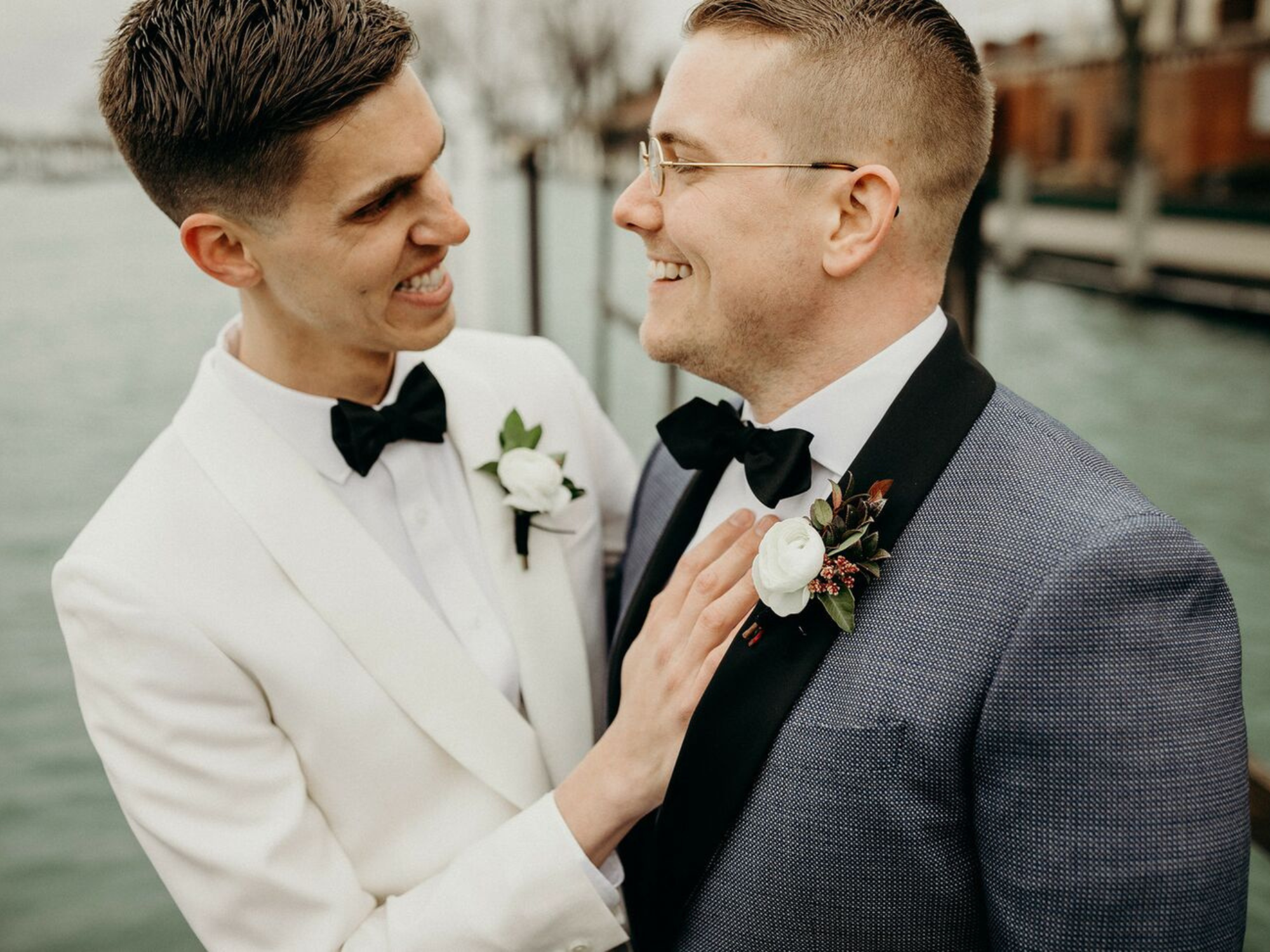 Cute couple smiling wearing black wedding bow ties