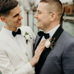 Cute couple smiling wearing black wedding bow ties