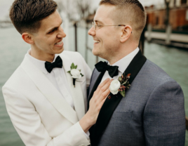 Cute couple smiling wearing black wedding bow ties