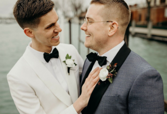 Cute couple smiling wearing black wedding bow ties