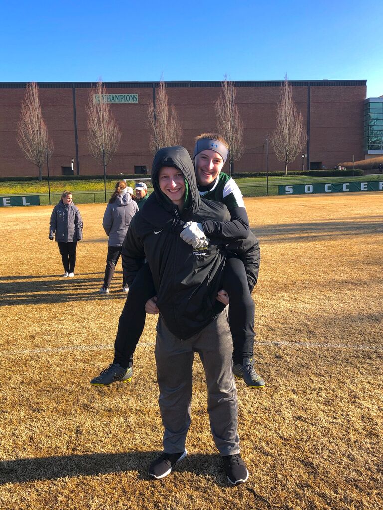 Just like Sara went to watch DJ play baseball in the Spring, DJ was at Sara's soccer games in the fall. This photo is after the women's soccer team won their second straight ECAC championship on a VERY windy November day. 