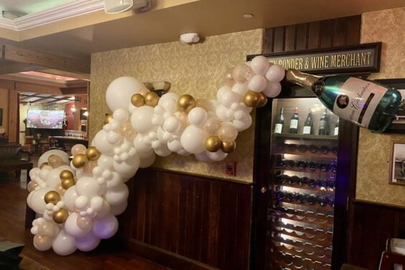 champagne pop balloon wall decor