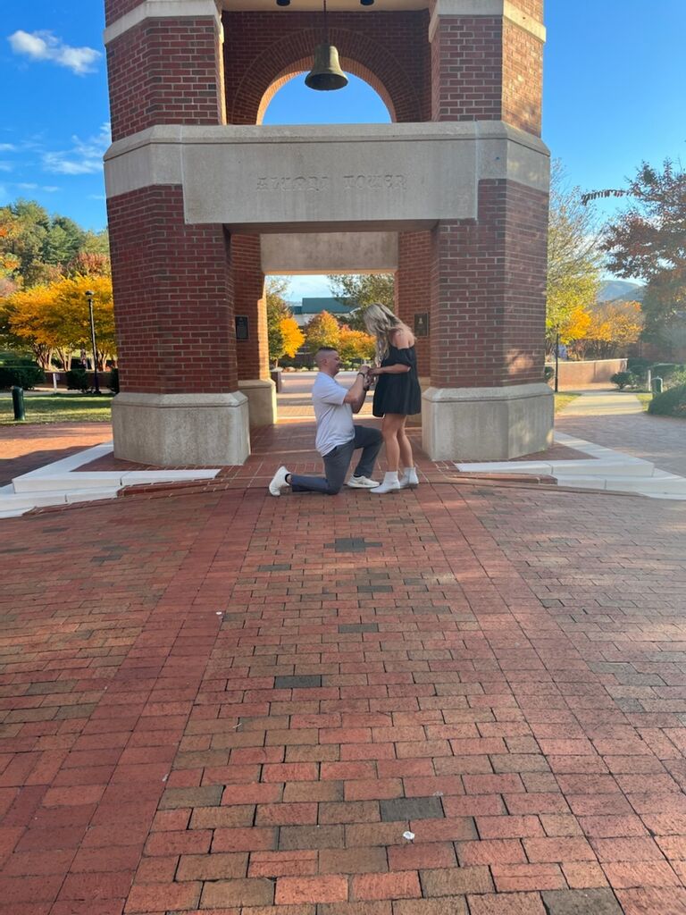Robbie proposes to Rachel in front of the bell tower at Western Carolina where they met and fell in love.