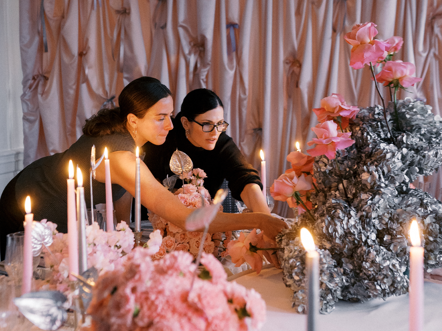 wedding vendors setting up a table