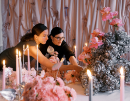 wedding vendors setting up a table