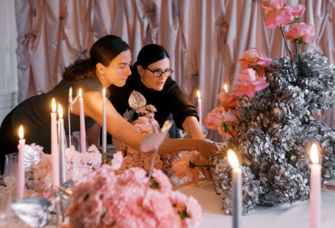 wedding vendors setting up a table