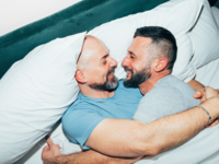 Couple laying in bed together, sex anad aging