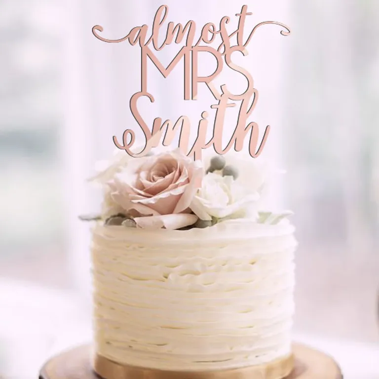 'Almost Mrs' custom rose gold bridal shower cake topper