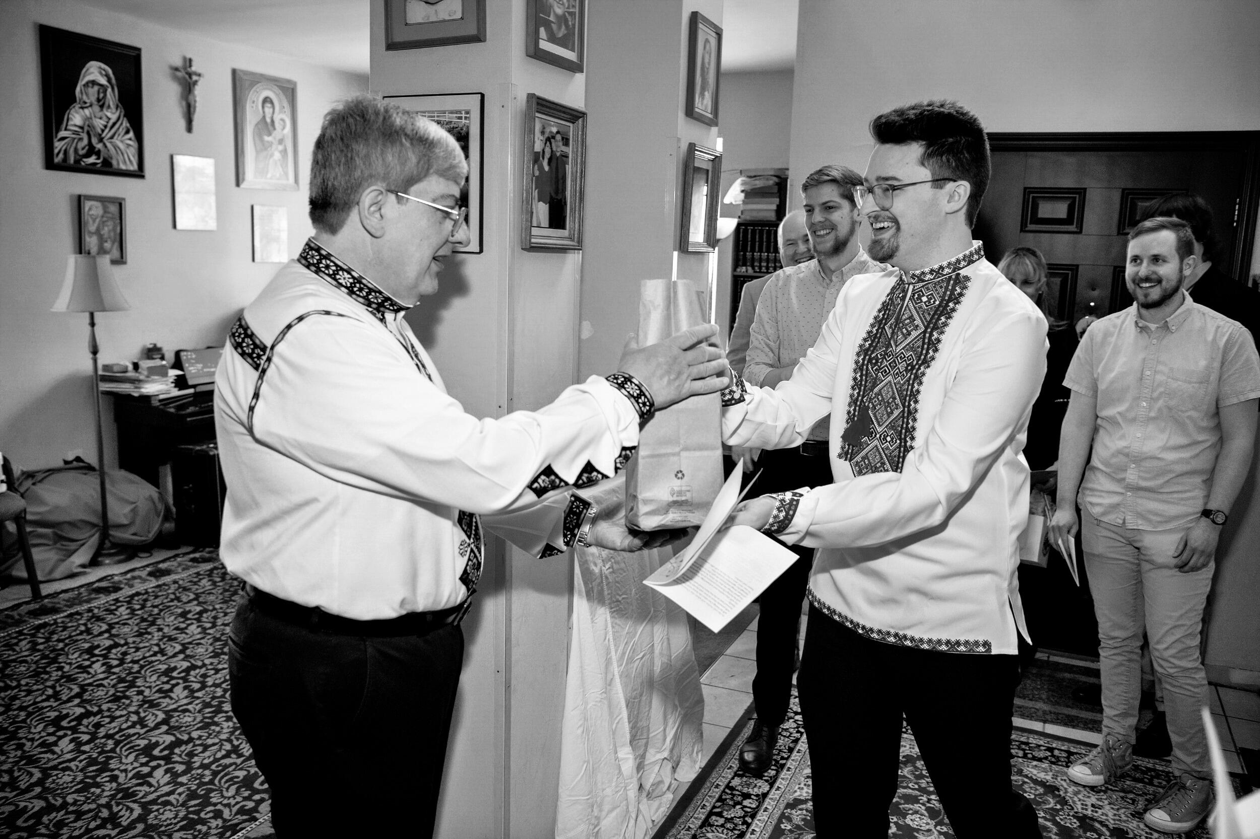 In an effort to sooth the pain of losing Christina, Arthur offered her parents some good alcohol and sweets. A gift that was graciously received. 
After this, the next part of the ceremony began