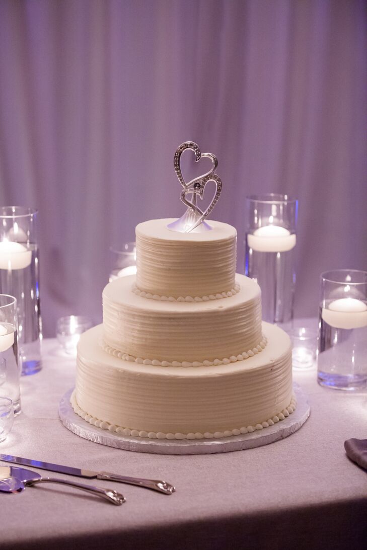 Three Tier White Wedding Cake With Candles