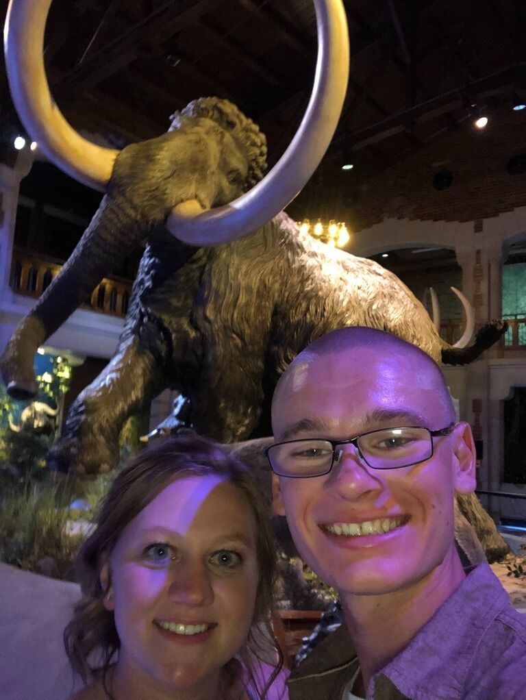The Smallman's wedding at the Toledo Zoo. Kyle HAD to get a picture by the Mammoth.